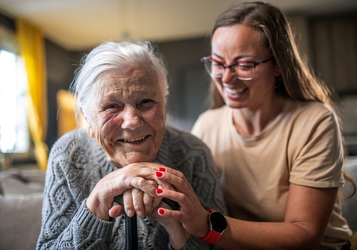 A smiling grandmother with her granddaughter