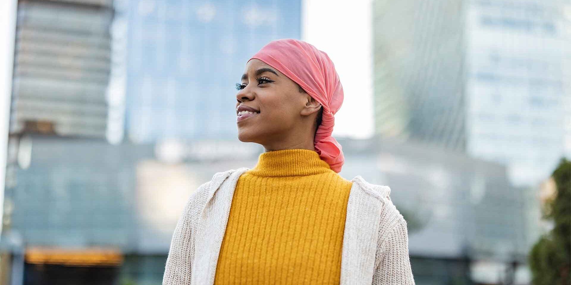 A young woman standing in the city